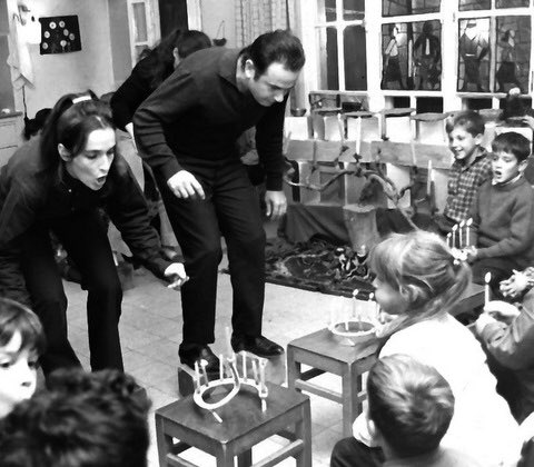 Parents play Hanukkah games at a kindergarten party, Israel in the 50’s.