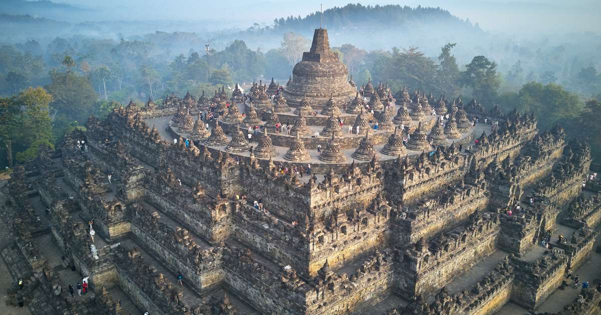 59. Borobudur Buddha HeadClimbing the steps of Borobudur parallels the path to enlightenmentAt the bottom, carvings illustrate the disappointments of daily lifeAt the top, they show the Buddha, meditating and teaching