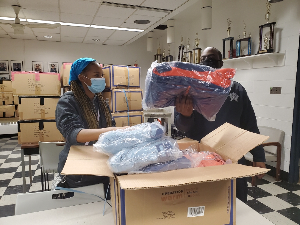 ChicagoCAPS03's tweet photo. Youth Volunteer helping to sort coats for the #3rdDistrict @OperationWarm !!! #Community #PositivePoliceInteraction https://t.co/LBB2hxBbxv