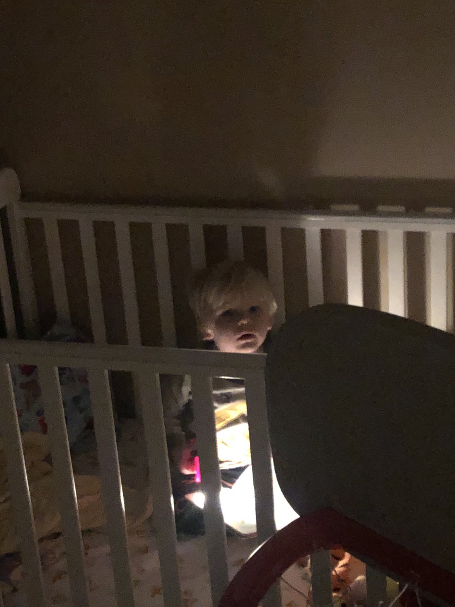 Mason is laying in his crib supposed to be going to bed. He keeps asking for his flashlight so he can read a book. How do you not bring in a flashlight? I walk in 4 minutes later..