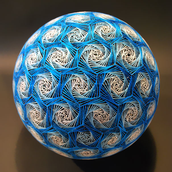 womensart1's tweet photo. Japanese artist Nana Akua photographed her grandmother's embroidery - a folk art known as Temari, meaning ‘hand ball’ given as special gifts #womensart https://t.co/4QItCbIgAQ