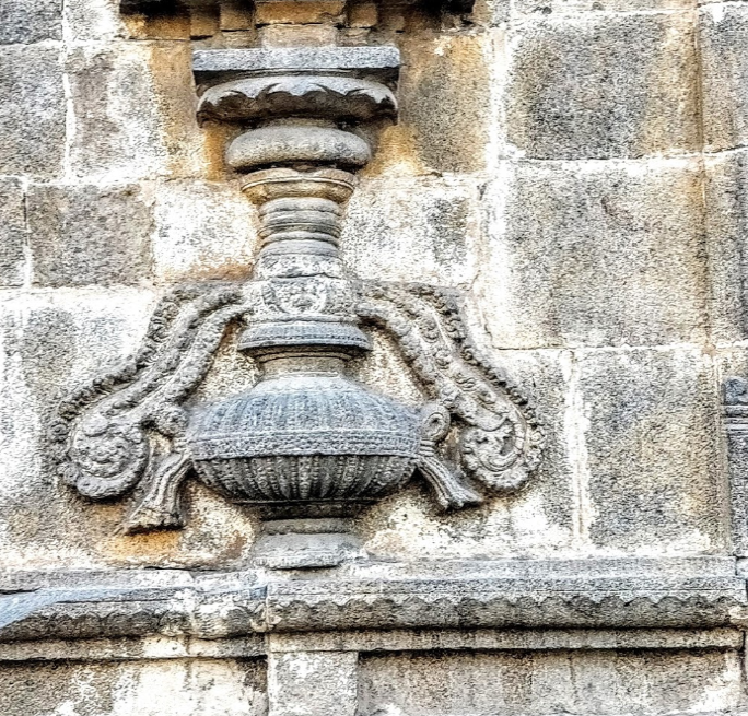 Purna kalasha carved on the wall of temple.