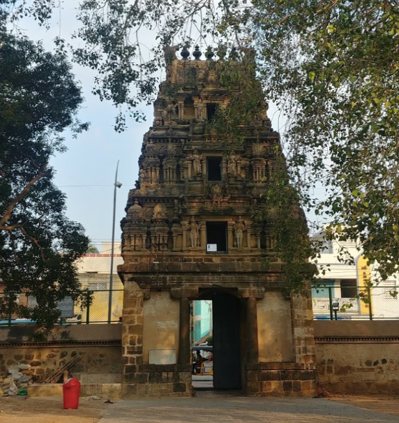 Entrance of the temple which has elaborated carving on the walls of gateway.