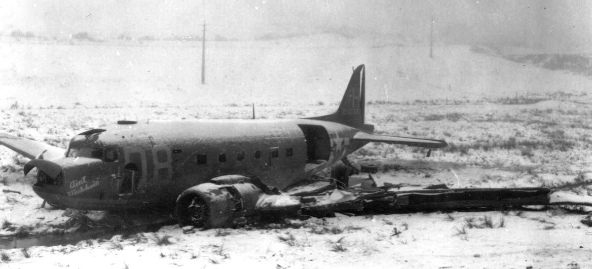 One of the most famous photographs to come out of WWII of a C-47 wreck is this one, showing "Ain't Miss-Behavin", flown by Captain Ernest Turner of the 94th TCS. He was hit by flak with his glider still in tow, but held until the last minute before release. Turner successfully /1