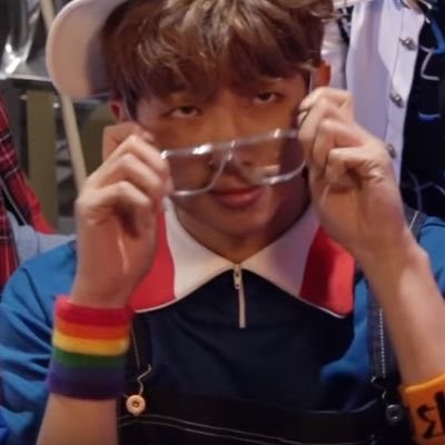 namjoon wearing a pride flag wrist band