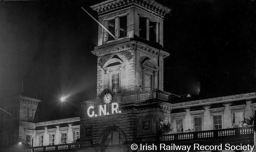 Neon lights of the Great Northern Railway beam from the tower at Amiens St (Connolly Station), Dublin; during An Tóstal festival of 1953. #Light, the final railway archive picture for week's #ExploreYourArchives.💡🚂#irishrailarchives