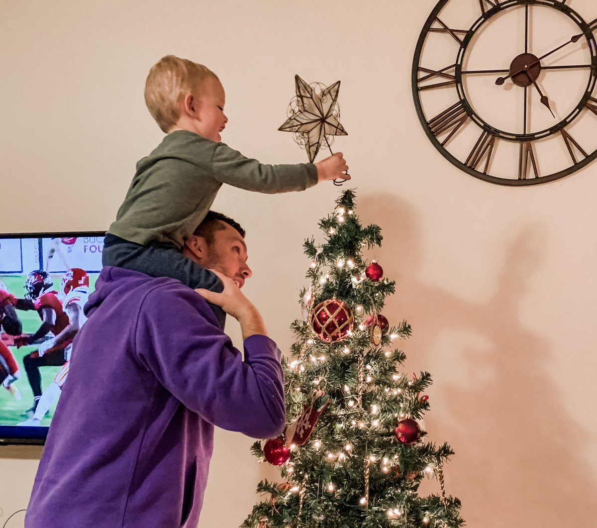 Big job this year for Jace. First time putting star on top of the Christmas tree.