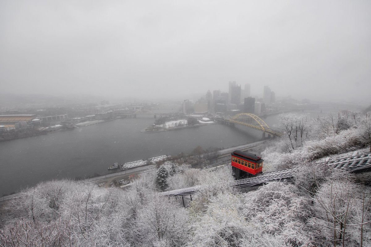 Wow...what a morning. The first snow of the year in #Pittsburgh did not disappoint. I have a bunch of new, unique images to share, but we'll start with a tried and true classic: the Duquesne Incline climbing Mt. Washington behind snow covered trees today. Doesn't get much better.