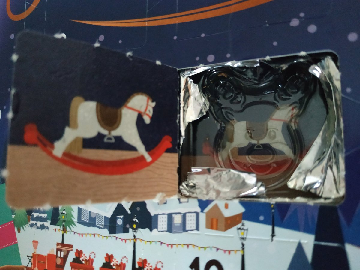Advent Calender featuring a rocking horse on the inside door.