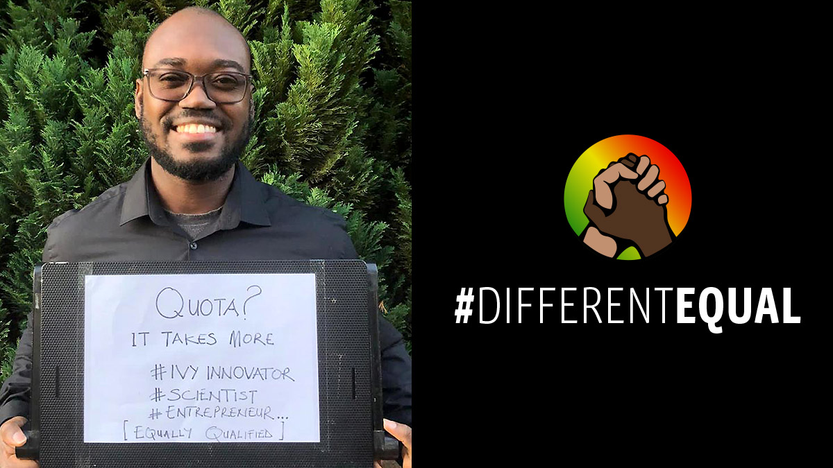 Student Ache Atta-Boateng holds a board with words written on it saying 'Quota? It takes more #ivyinnovator #scientist #entrepreneur [equally qualified]'