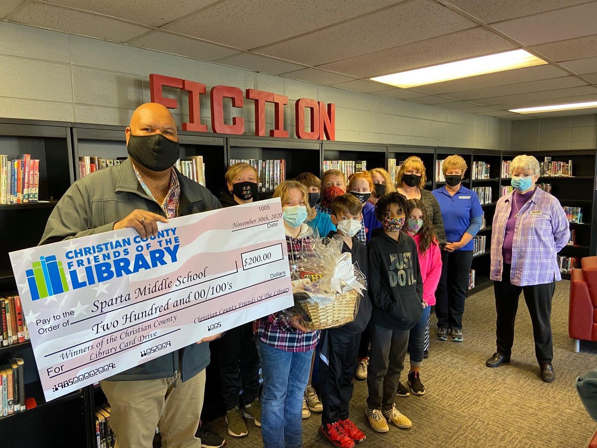 SpartaMiddle's tweet photo. Friends of the Christian County Library presented SMS with a $200 check for winning the Christian County Library card drive. Because of this effort, more of our SMS students &amp; staff now hold a public library card. We look forward to the opening of the Sparta branch in spring! https://t.co/0WFLYbScVn