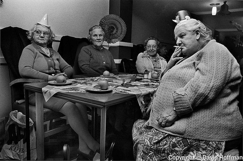 Day 1.The Ghosts of Christmas past  #AdventCalendar.Christmas Party at a pensioners lunch club in Tower Hamlets, 1975. Photo © David Hoffman.