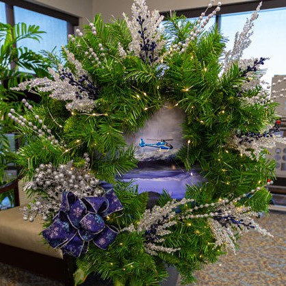 FRASCA sponsors a wreath each year for the Junior League's Festival of Trees. This years theme: Happy Helicopter Holidays.