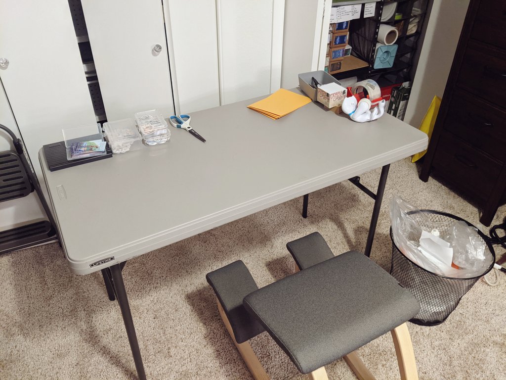 My table. My office is big enough for a mobile table. I still use the floor for when I have a LOT of things, but a folding table can be moved around the office and I can leave things out on it.I have business cards, tape, pens and paper for writing and scissors + a trash can.