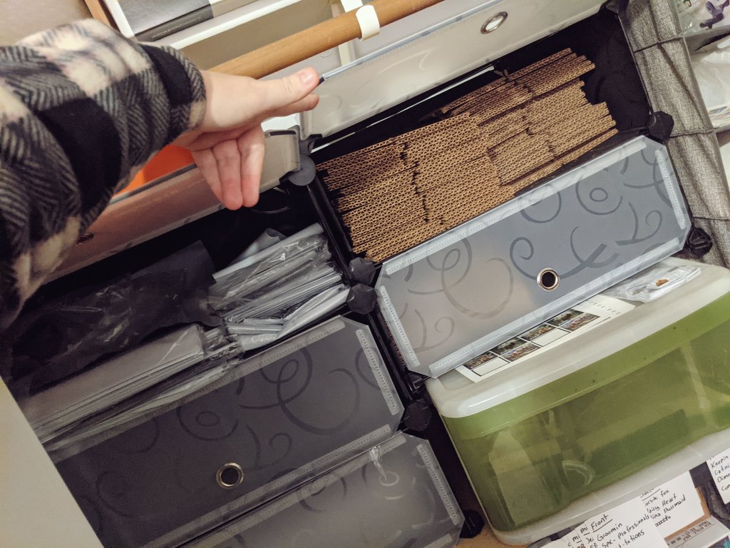 The closet is mostly a series of shoe organizers I have repurposed in various ways. Hanging ones for storing tape, stamps, or other goodies.Wooden ones up top for holding boxes of envelopes or other large things.Plastic modular ones with doors for storing polybags and boxes.