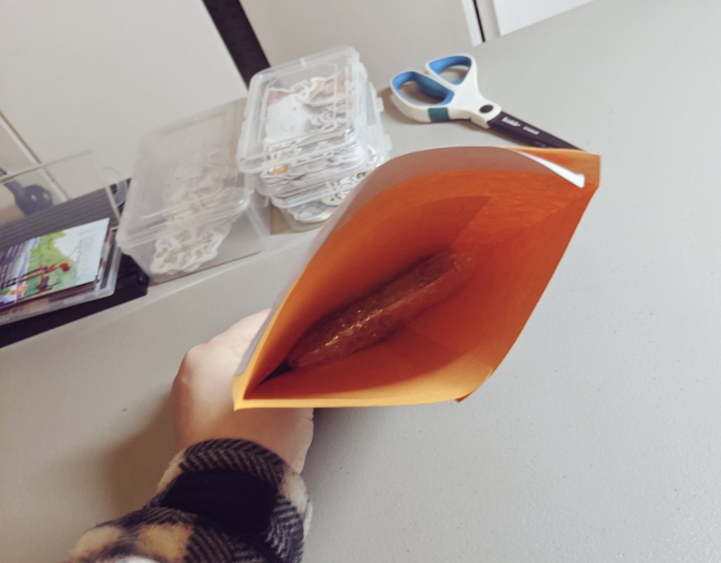 From there I have a finished wrapped item! I just slide it into the envelope and seal it up! It's ready to go! Repeat for each item. I usually seal items as soon as I wrap them to prevent envelope mix-ups.