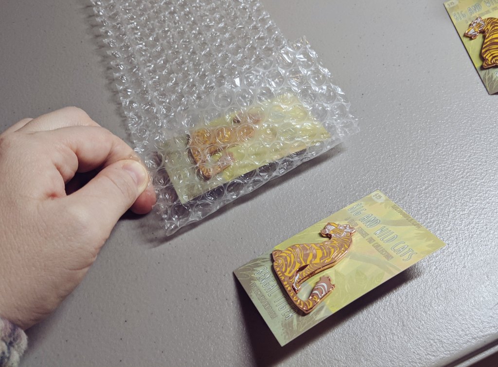 What about multiples?I just wrap things a bit differently.For 2 pins I wrap them very similar but face to face with a layer of bubble wrap between them.This prevents scratches or dents to the pin face and the backs should have enough bubble wrap to pad them.