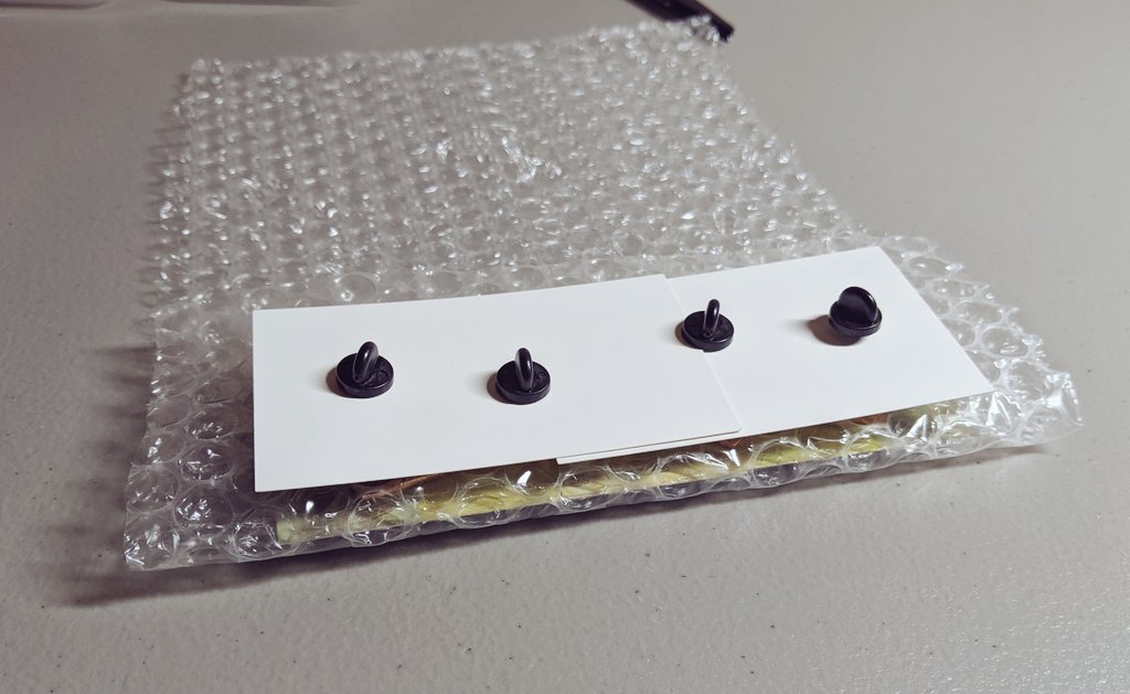 For 3-4 pins I use a larger strip of bubble wrap and nestle the backing cards together to reduce surface area before wrapping them the same way. It fits with room to spare in an 5x9 envelope. You can do 2 rows to easily fit 8 pins in a small envelope.