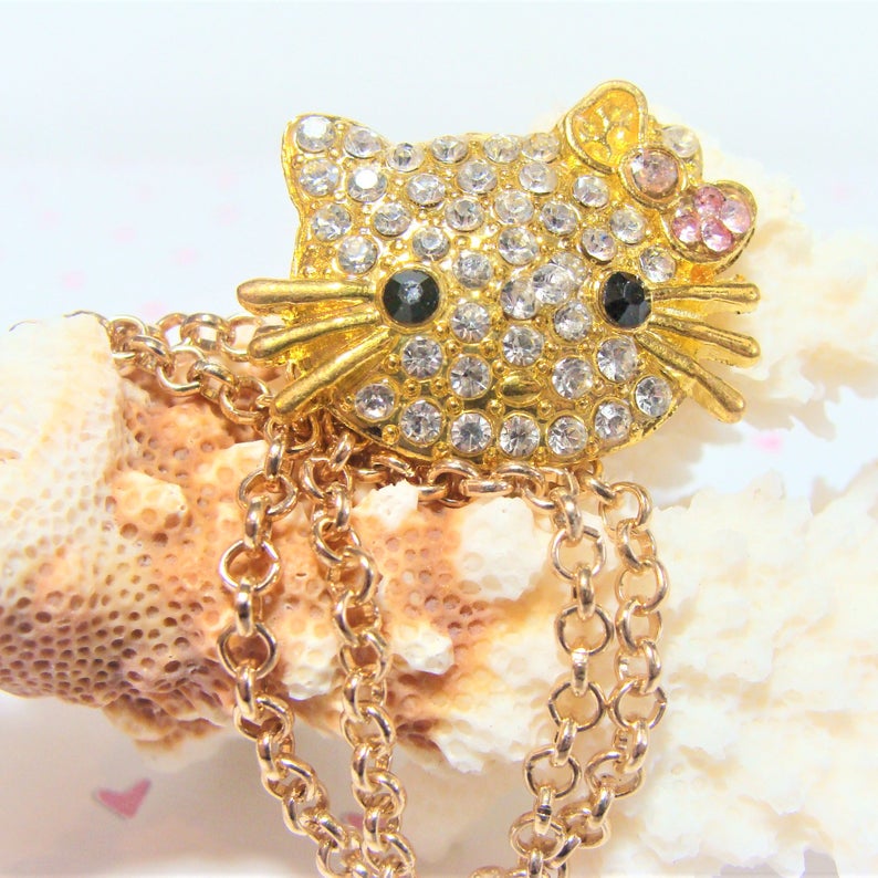 girliegals12's tweet photo. For that Special Little Girl ~
Gold Sparkly Hello Kitty Rhinestone Necklace: https://t.co/LMjI3pxOj1 #HelloKitty #HelloKittynecklace #HelloKittyjewelry #goldnecklace #rhinestonejewelry #sparkle #adorable #giftforgirls #etsyhandmade #etsyseller #etsyChristmas #shopsmall https://t.co/qztXGEByUJ