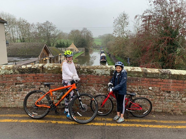 BromsPrep's tweet photo. Well done to Riya and Xanthe who completed a 10.1 km bike ride on Sunday, to raise funds as part of the Flourishing Fivers initiative for @PrimroseHospice. They did absolutely amazingly, together with Xanthe’s mum and Riya’s dad, through mud, rain and the cold weather. https://t.co/927OOica1i