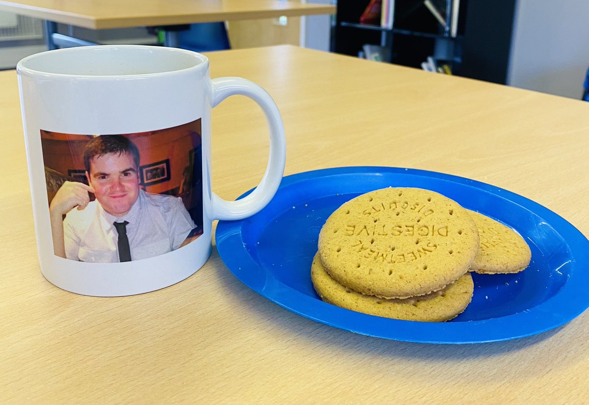KaizenPrimary's tweet photo. When a member of the team can see the HT needs some TLC and brings you this. A mug of tea with their photo on it and some biscuits. Made me laugh! 💕 @eko_trust #HTwellbeing https://t.co/NFhhplh5a3