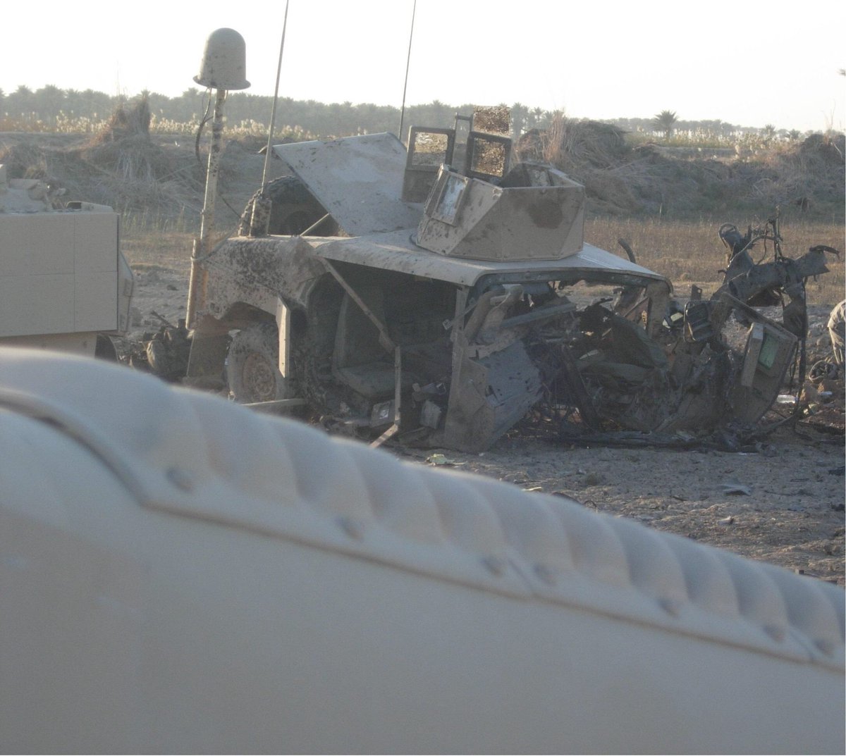 I opened my eyes and saw our heavily armored 12,000 lb M114 HMMWV completely destroyed, laying on its side and facing the wrong direction. (The photo below was taken after it was tipped back on its bottom).