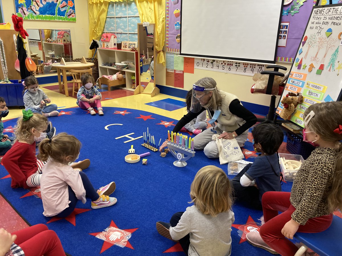 Learning all about Hanukah: lighting a menorah, story of the Star of David, the dreidel game and much more. #trinitylearns