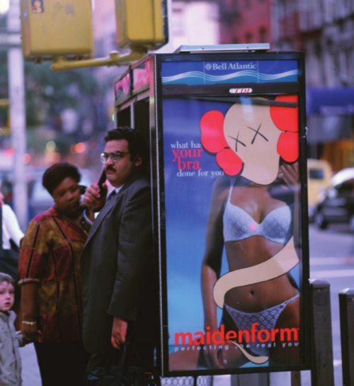 By the early 90s, KAWS was off to New York’s School of Visual Arts. There he began “subvertising” images — on bus stops, phone booths and billboards. KAWS grew in notoriety as the public became more and more captivated by his ads.