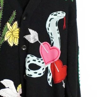 2. a blue green star ... not much to add there3. two hearts pierced with an arrow (falling in love - cupid anyone?) - behind that a cobra (could stand for wisdom, sexuality, transformation or danger and poison - snake, in general, can mean betrayal and Satan)