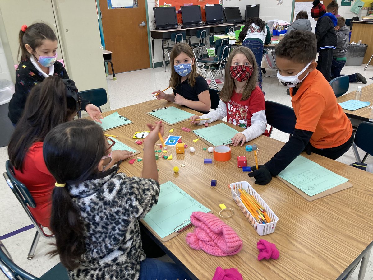 Working on matter for science. Students are sorting their objects according to their shapes. They were making observations, having discussions and naming their shapes, and sorting them.
