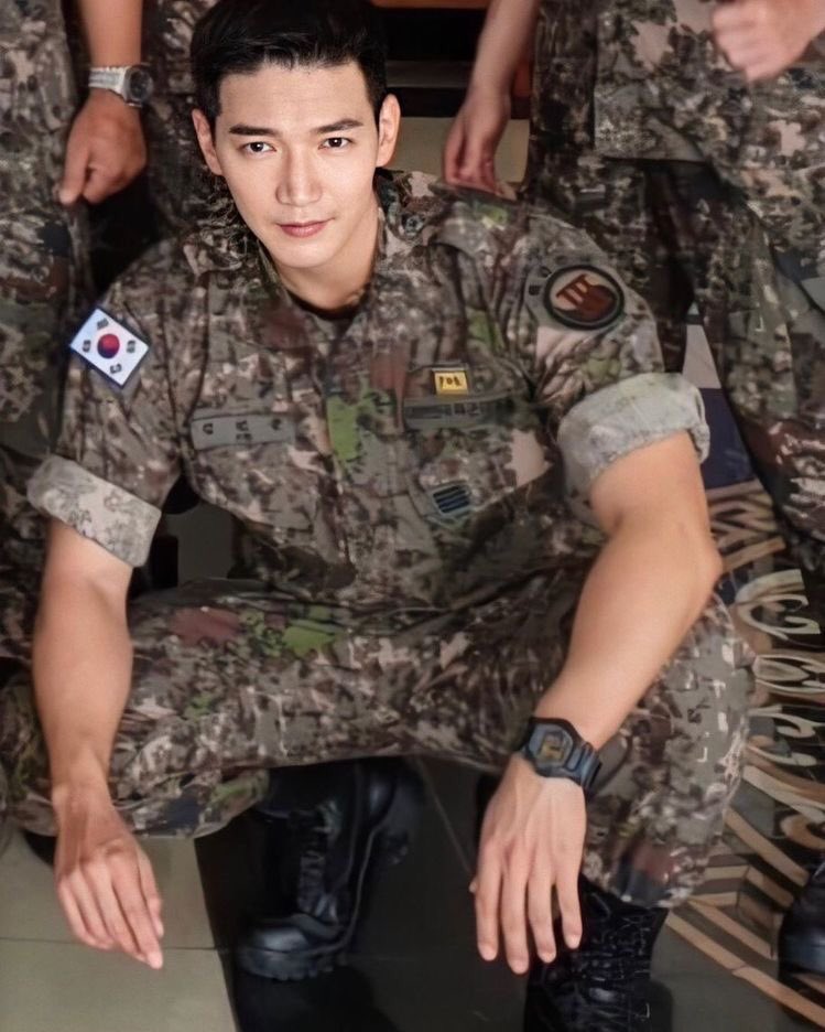 a thread of 2pm wearing military uniforms