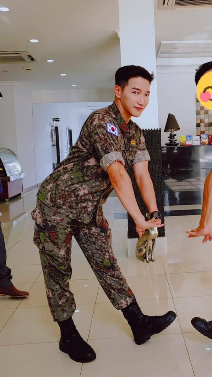 a thread of 2pm wearing military uniforms