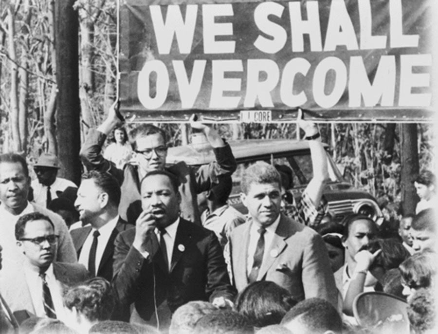 “We Shall Overcome” is too inaccurate. Don’t say it. It could mean anything. What *policy* is it advocating?