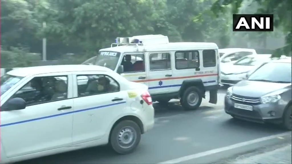 ANINewsUP's tweet photo. Noida: Slow traffic movement seen on a road near Sector 16  amidst blockades in wake of #FarmersProtest 

Visuals of ambulances caught in slow traffic https://t.co/Adm7gof2Mi