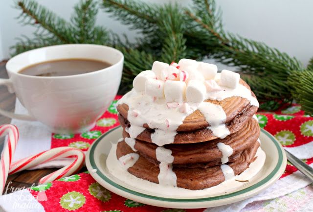 Light &amp; fluffy #pancakes are infused with lots of #hotcocoa &amp; peppermint flavor, and then topped with a super simple marshmallow cream topping in these Peppermint Hot Cocoa Pancakes. Get the #recipe now at>> bit.ly/2BxTnih #breakfast #brunch #Christmasmorning