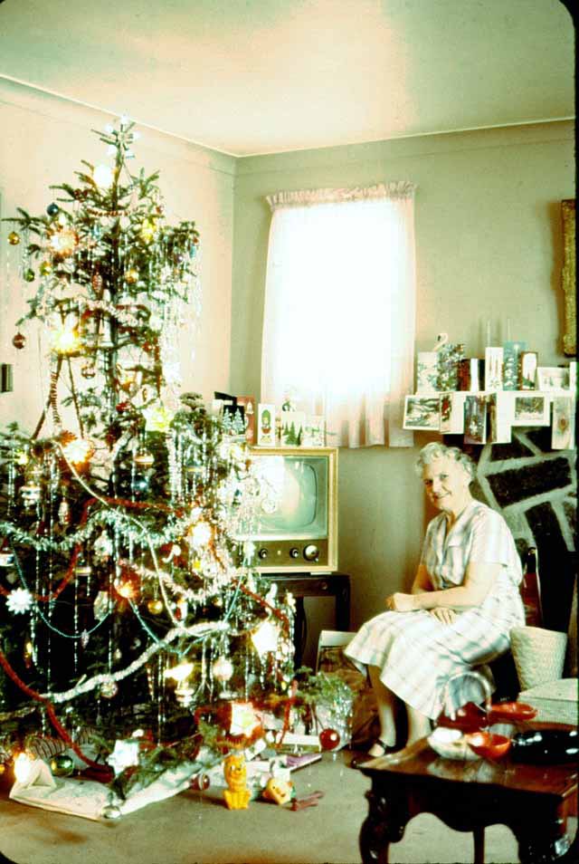 Photos of women posing with their Christmas trees (1950s/60s)Love them all.Enjoy!!