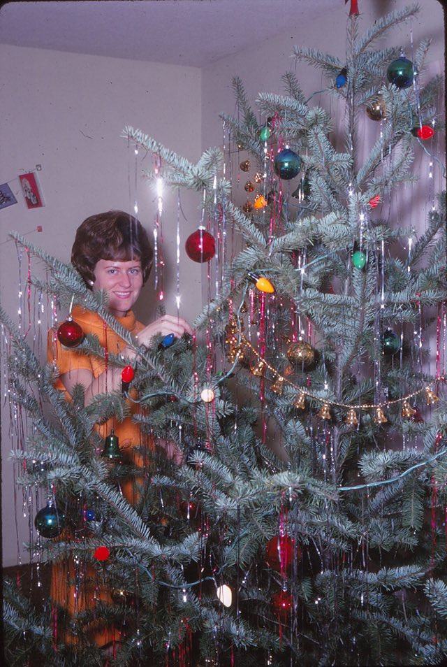 Photos of women posing with their Christmas trees (1950s/60s)Love them all.Enjoy!!