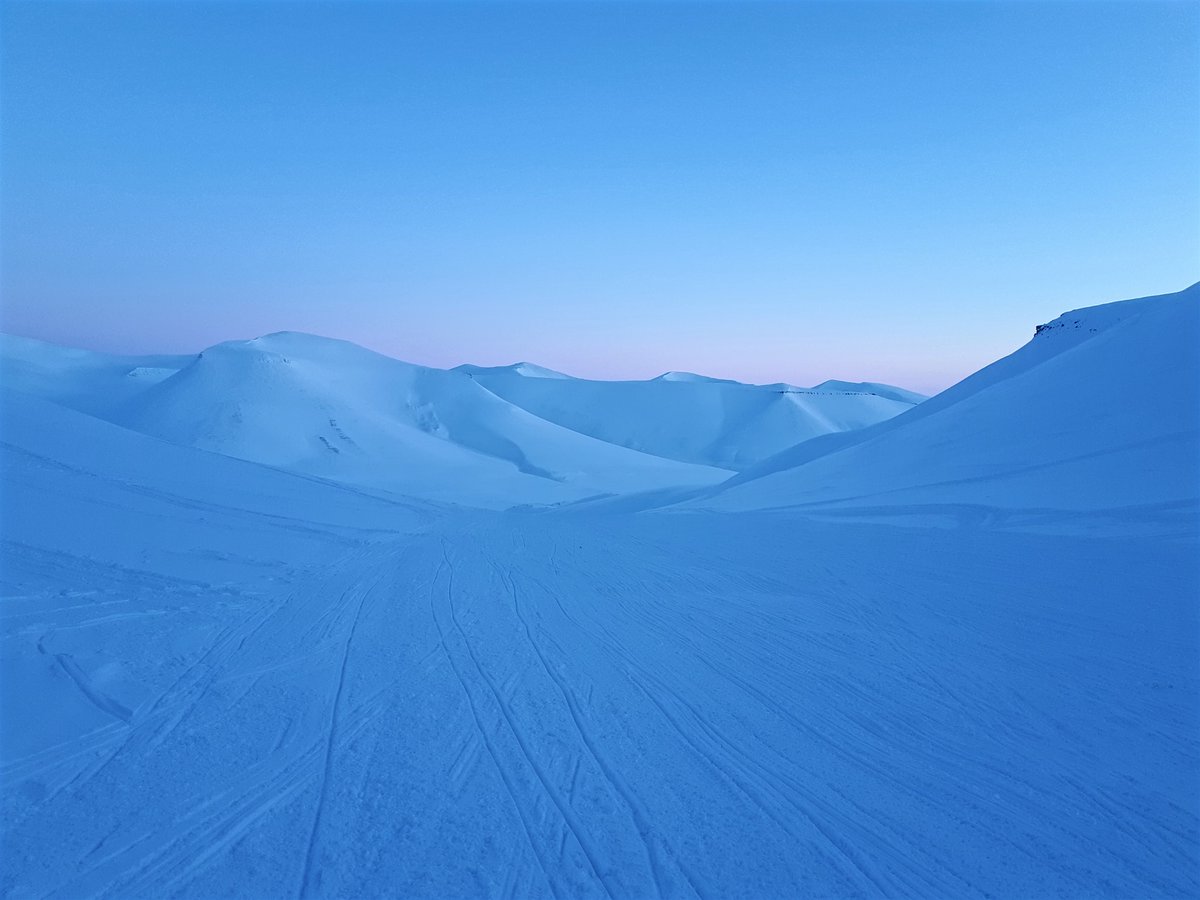 5) To stay in mountainous terrain in this  #travel pictures  #advent calendar: a travel memory from the island of  #Svalbard. Going on a snow mobile ride under the pastel-coloured  #Spitsbergen skies of early March was certainly a big travel highlight of the last few years.