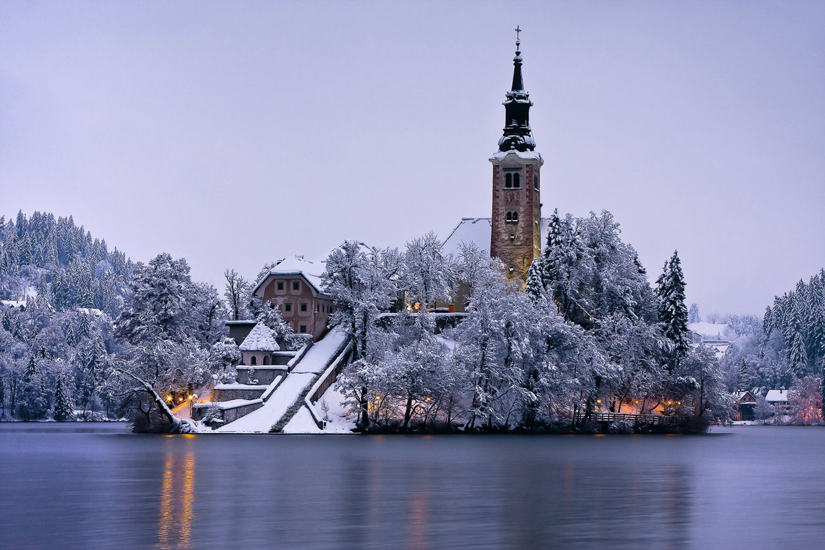 travel_slovenia's tweet photo. BLED ISLAND, #Slovenia - yesterday it started #snowing in #Bled for the first time this #winter and the Bled island with its #church looks even more picturesque when it's covered with a white blanket of #snow. (photo: Franci Ferjan #photography) #Travel #ifeelsLOVEnia https://t.co/PzBE56IHpY