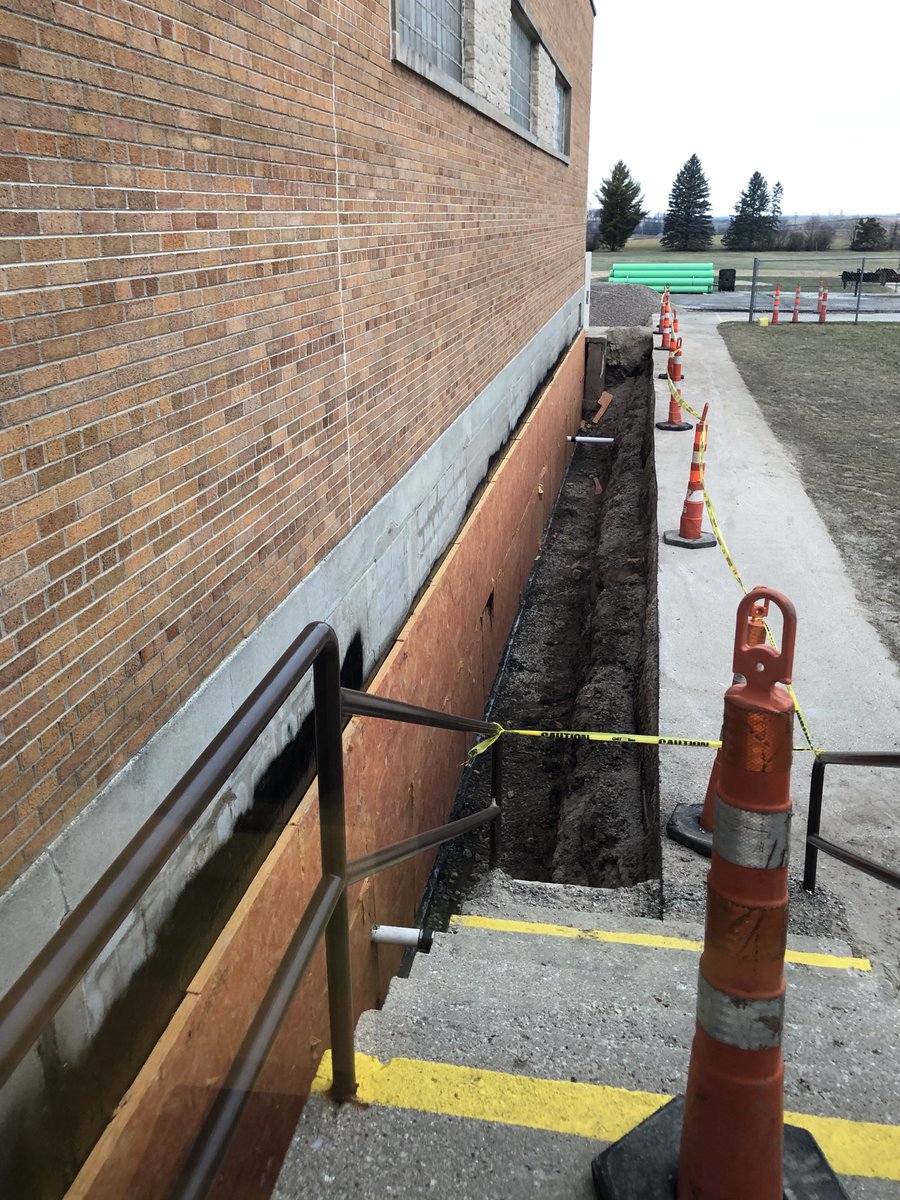 More building progress, Huskies!  A crew from Lamers Construction is upgrading piping and the elementary school basement exterior walls with sealant and insulation.  Up next, basement, gym, windows, and exterior.  Thank you all for your support of this needed work!