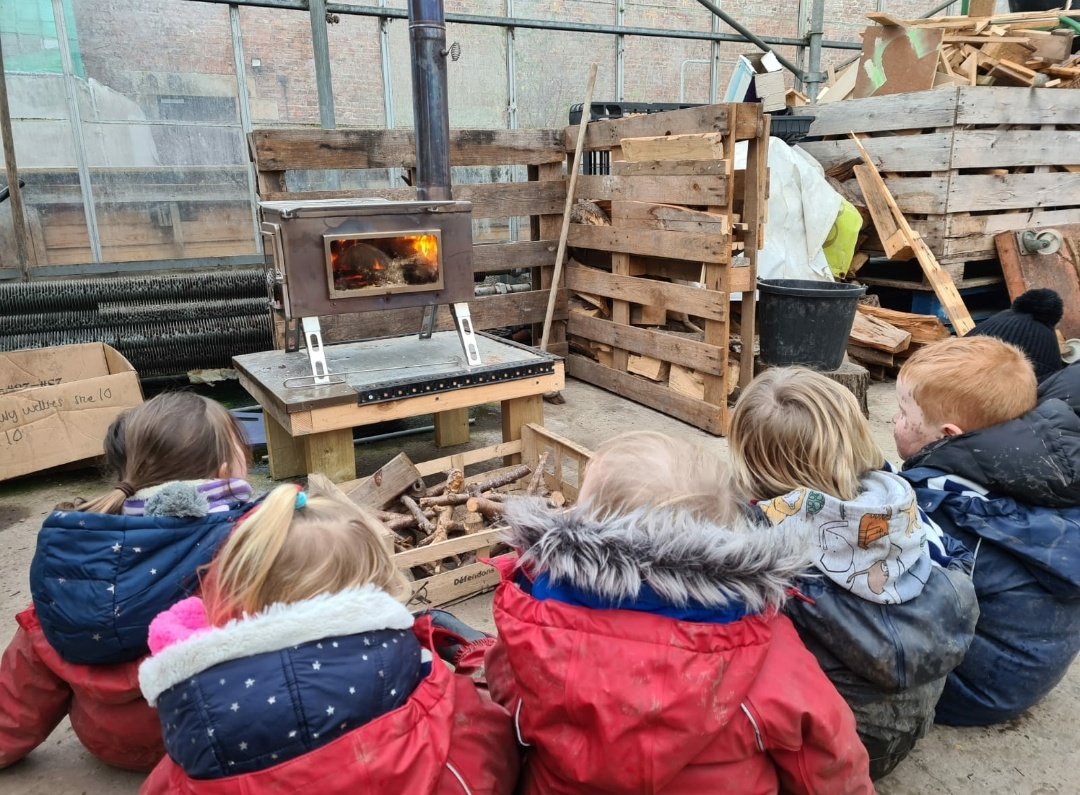 MidEYLCOL's tweet photo. The finches looking at the icy pond, discussing weather and its effects. Then heating up by the logburner learning about fire safety and what fuels fire, before we have a real fire in the park. #redjacketpeople https://t.co/XLCjunEmKA