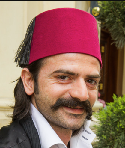 Arabs call a fez a 'tarbūsh' (طربوش) from the Persian words 'sar' and 'pūsh' (سرپوش) meaning 'head' and 'wear' respectively, but the Persians call it a 'fineh' (فینه). The English word comes from French, because Fez, Morocco was a place of production.