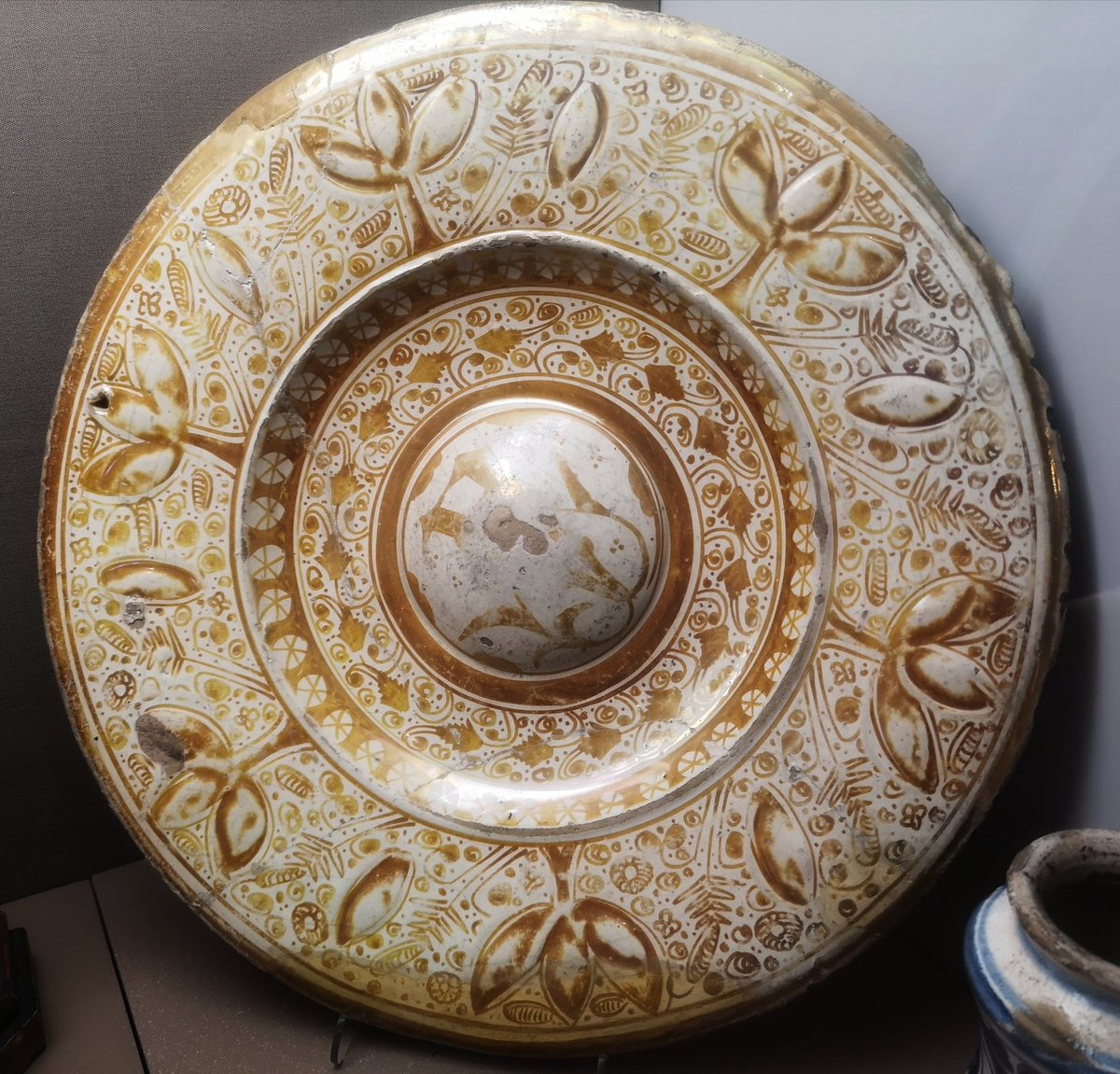 A tin-glazed jug (c.1600) and a tin-glazed charger with lustre decoration (mid-16th century) from Spain, both in the Royal Cornwall Museum.