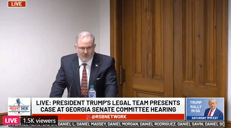 Witness states he worked Fulton County recount: Saw large numbers of ballots that were not marked with a writing instrument. They were marked by a machine. Says he tried to bring attention to 9 red ballot bags without security tags and he was removed.