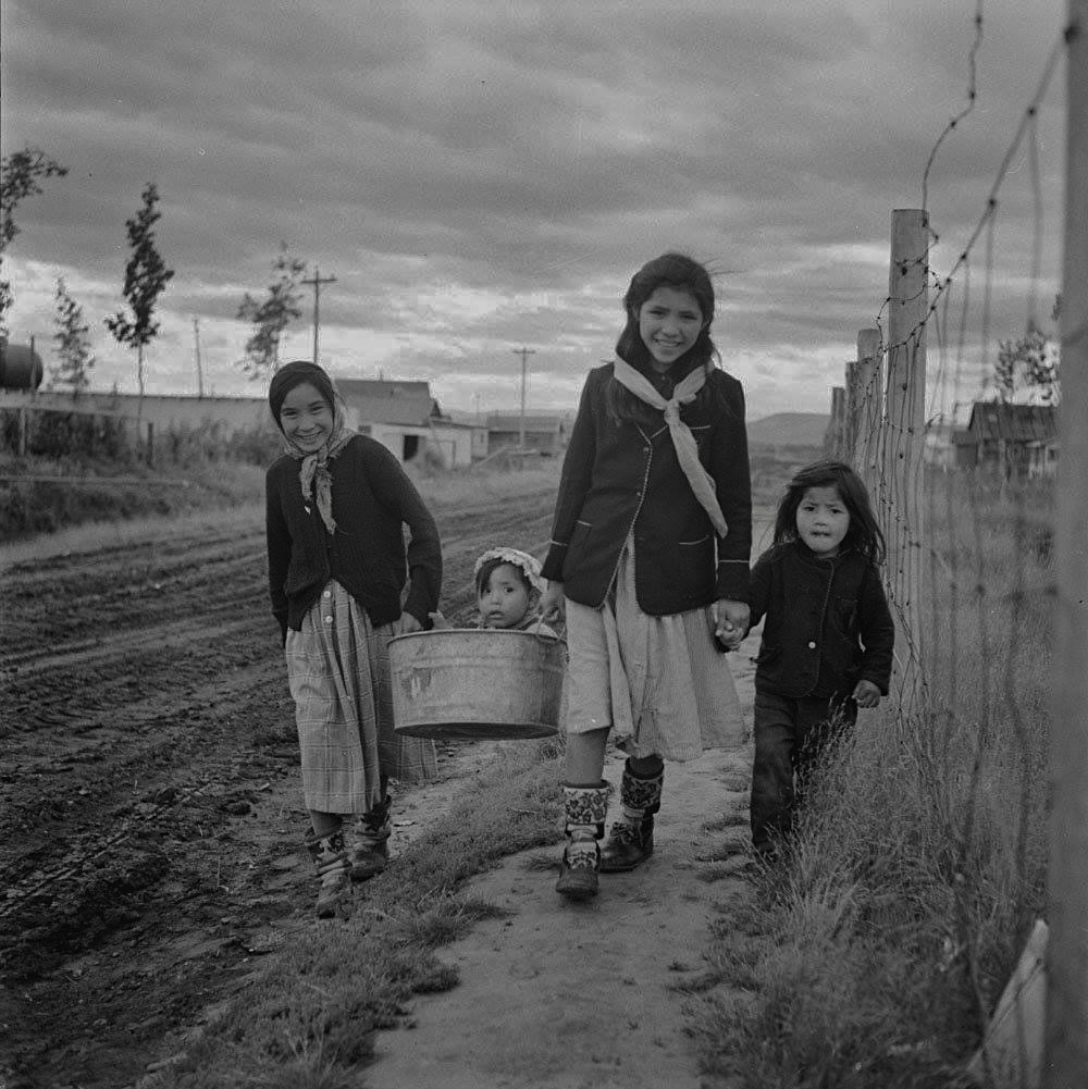 Alice Semple, Alfred in tub, Ruth and Georgina Greenland (Gwich'in/Inuvialuit) ~ Aklavik, NWT 1956

Photo: Rosemary (Gilliat) Eaton
[LAC]