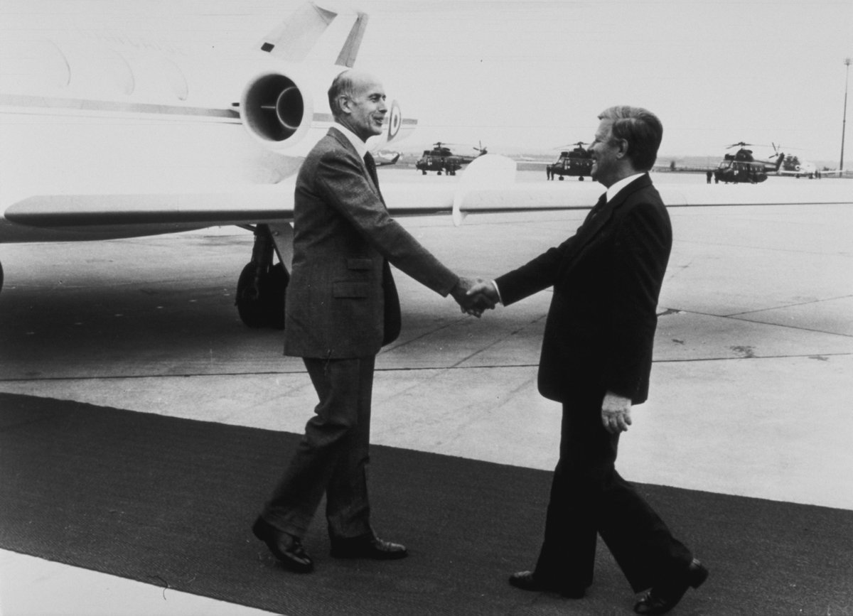 Valéry Giscard d'Estaing is welcomed at the airport by German Chancelor Helmut Schmidt for a Franco-German meeting 