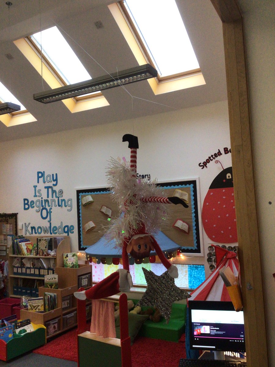 It seem our elf is quite the acrobat... but he keeps getting all muddled! Yesterday stuck in the toast, today all tangled up hanging from the ceiling! He caused quite a commotion at breakfast this morning 😃✨ #elfontheshelf #nurserychrisrtmas