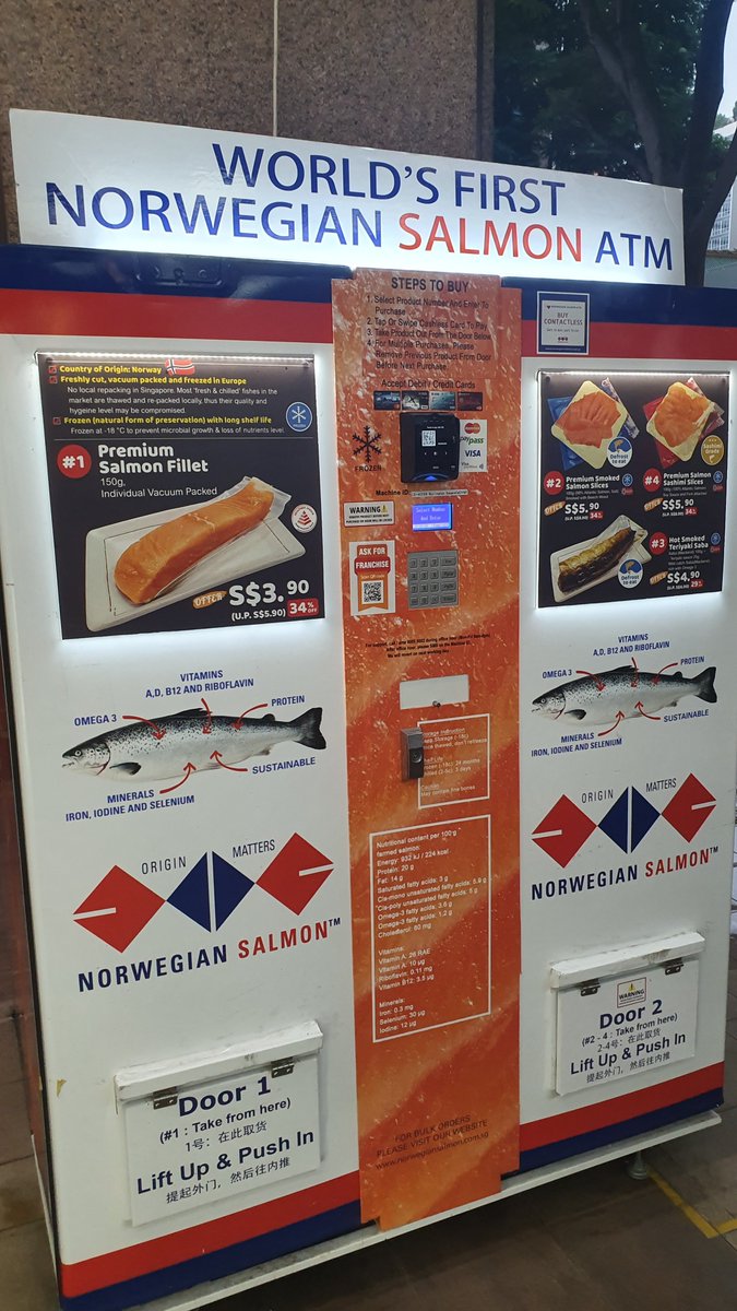 An vending machine in Singapore selling norwegian salmon, with a title saying Worlds First Norwegian Salmon ATM 
