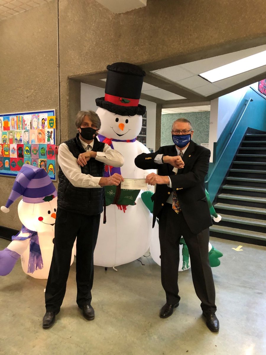 RotaryClubYVR's tweet photo. Having partnered with John Norquay Elementary School for over 20 years, Rotarian Phil Webber presents a cheque to Tim Krug, Principal of Norquay, on December 10, 2020 in order to cover the cost of ten iPads required for remote learning in times of Covid. https://t.co/yGWNzsFjMl
