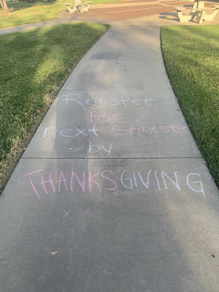 SGANewman's tweet image. The SGA Public Relations Committee went out and chalked campus before break to remind students to enroll early for the spring!

Have you enrolled? #SameValues #AcademicExcellence 🎓🎓